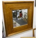 A square gold painted bevel edged wall mirror. 74cm