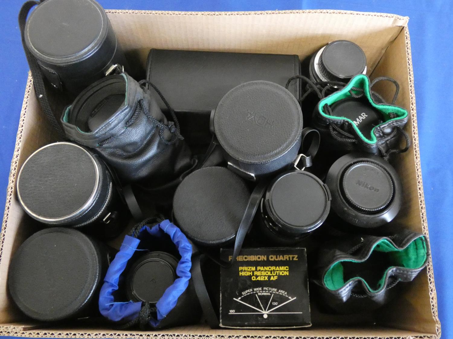 A quantity of camera lens, to include Pentax 80-200, Hoya 80-205, Nikkon 70-300, Sigma auto focus,