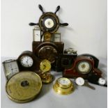 A collection of carriage and mantle clocks to include, a Smiths bakelite clock case, and a wall