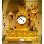 A 19th century French gilt metal mantle clock, the central white faced dial between angel figure