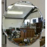 A dodecagon bevel edged unframed wall mirror. 56cm diameter.