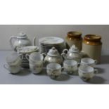 A Japanese hand painted fine porcelain tea service, comprising tea pot, sugar bowl, milk jug, 8