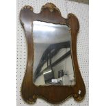 An oak framed wall mirror with gilt edging. 86cm long.