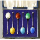 A silver and guilloche enamel set of six coffee bean spoons, Birmingham 1965, case.
