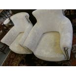 A pair of tub armchairs, upholstered in white fabric with black studs (2).