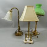 Three brass table lamps, one with swan neck stem, one with oil lamp style shade and one with