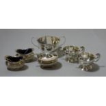 A silver mustard pot, Sheffield 1910, two pairs of silver salt pots and a sugar bowl.