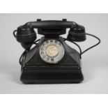 An early black bakerlite telephone.