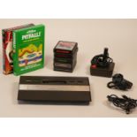 Atari CX-2600 Jr console with power supply, joystick, TV lead and collection of seven games