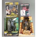 A Godzilla money bank, together with a Playmates Tomb Raider figure, a Bruce Lee figure, Quick