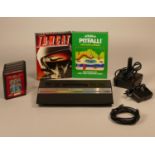 Atari 2600 games console, power supply, joystick, TV lead and a collection of seven games