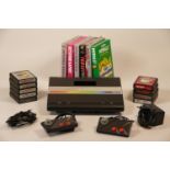 Atari 7800 video game system with power supply, two ministick controllers, selection of fifteen