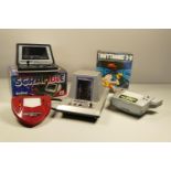 Collection of handheld and table top games- including TommyTronic 3D, Grandstand Scramble, Bandi