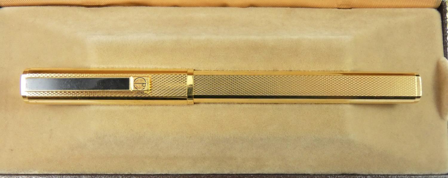 Dunhill, a gilt metal Gemline fountain pen, with engine turned body, 18K gold knib, warranty card, - Image 2 of 6