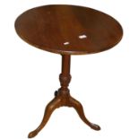 A circular mahogany tripod table, 59 cm diameter.