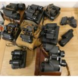 A collection of assorted cased binoculars and fieldscopes