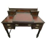 Maple & Co., London, a ladies mahogany writing desk, the leatherette fall front opening to reveal