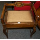 An Edwardian inlaid piano stool with low arms