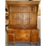 A Continental pine dresser, the open top with two side cupboards over 6 drawers, the base with