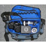 A Minolta X700 SLR camera with macro lens, an Empire Baby camera, boxed and other camera equipment.