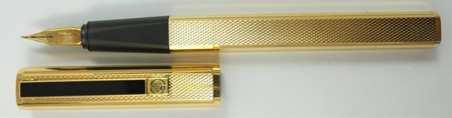 Dunhill, a gilt metal Gemline fountain pen, with engine turned body, 18K gold knib, warranty card, - Image 3 of 6