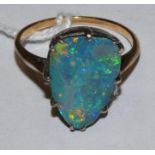 A gold mounted black opal doublet ring, 16 x 10 mm,