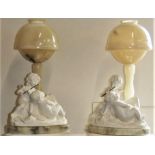 After Prof G. Bessi, a pair of carved alabaster table lamps each with a pair of cherubs, signed,