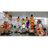 Six Murano glass clowns and a similar decanter (7)