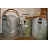 Three galvanized watering cans
