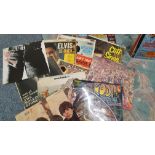 A box of over one hundred vinyl LP's and singles, primarily from the 1970's/80's.