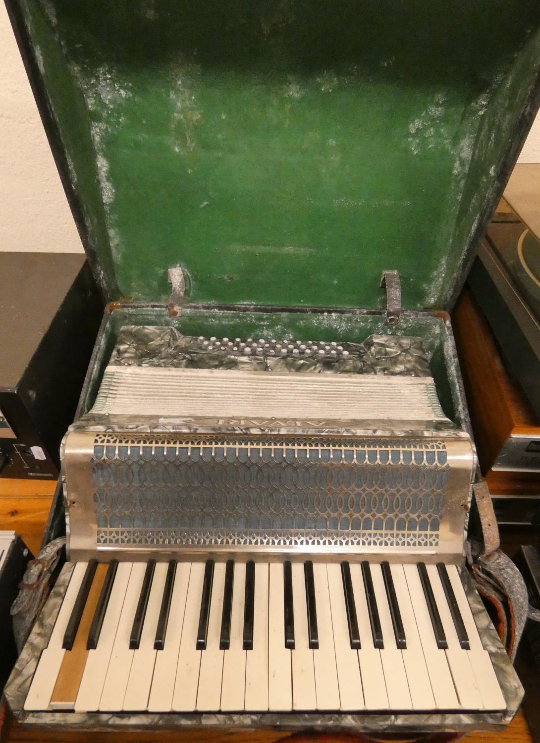 An Alvari piano accordion in case.