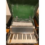 An Alvari piano accordion in case.