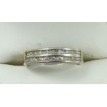 An 18ct white gold and diamond eternity ring, channel set with a double row of brilliant cut stones,