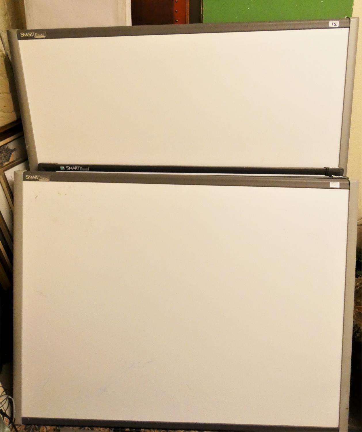 Four ex school Smartboards, with some associated equipment, each 140 x 110 cm.