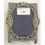 A Victorian cast silver photograph frame, London 1879, with pierced borders, 12 x 9.5 cm.