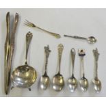 A Victorian pair of silver glove stretchers, London, no date letter, a silver tea strainer,