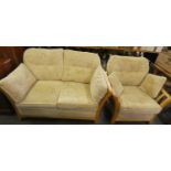 A light oak framed two piece suite comprising of a two seater sofa 145cm wide and an armchair (2)