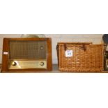 An early HMV wood cased radio together with a wicker fitted picnic basket (2)