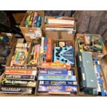 A large selection of board games, jigsaws and other games and two figures from The London Owl