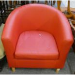 A red faux leather tub chair