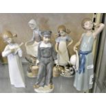 A collection of five Lladro ceramic figurines