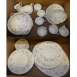 A Wedgwood April Flowers pattern dinner service comprising of 6 cups, 7 saucers, sauce boat, cream