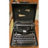 A Remington Rand model 1 typewriter, case.