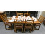 An oak Willis & Gambler dining suite comprising extending refectory table (92 x 180 cm, 286 cm