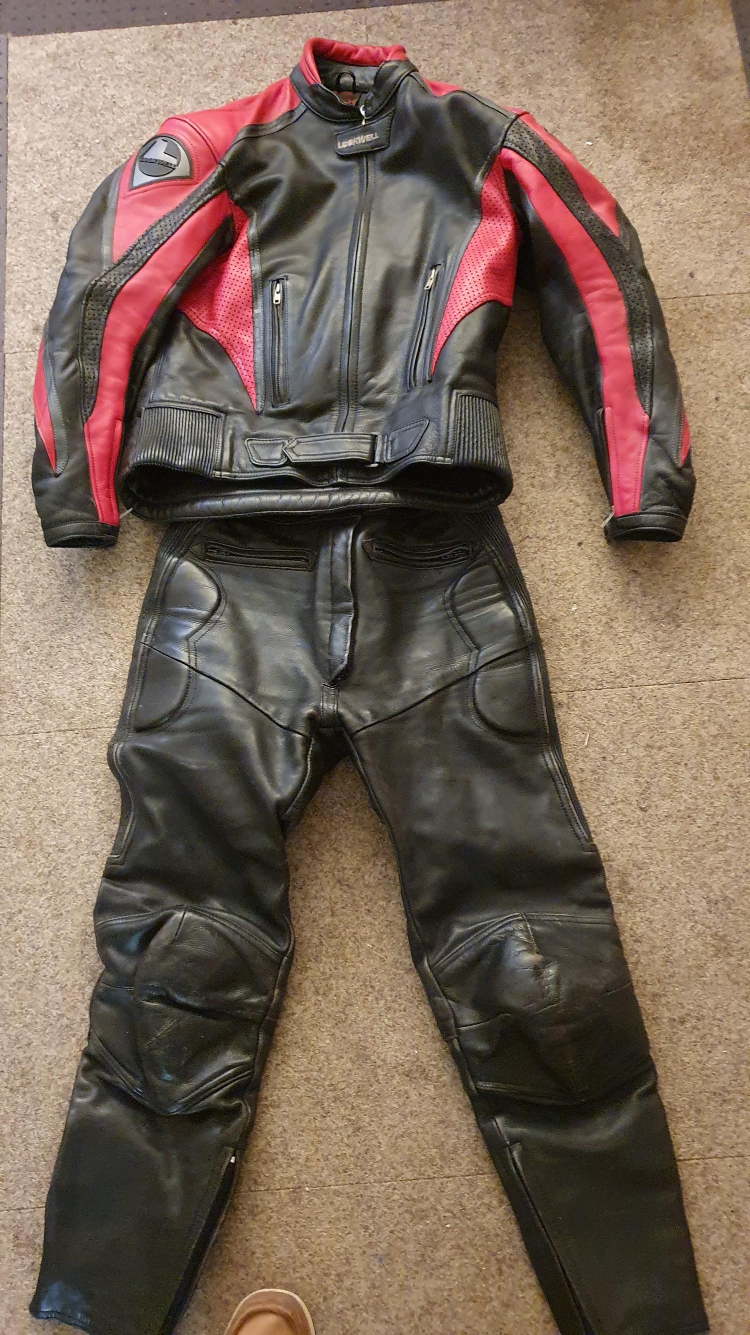 A Lookwell ladies leather jacket size M, together with a pair of Ashman trousers, size 14.