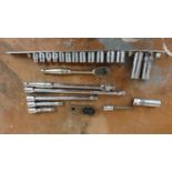 A Snap On 3/8" drive ratchet, various metric sockets and bars.