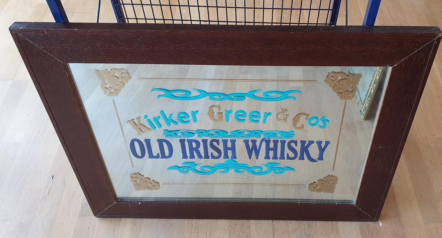 A mirror with painted Old Irish Whisky advertisement, 67 x 88 cm overall.
