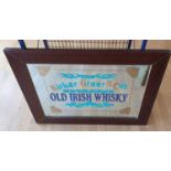 A mirror with painted Old Irish Whisky advertisement, 67 x 88 cm overall.