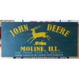 A painted advertising sign for John Dere, 40 x 90 cm.