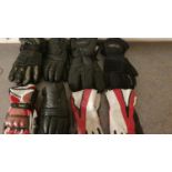 Eight pairs of motorcycle gloves